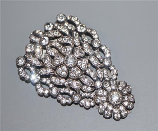 An ornate paste-set white metal clip brooch, 61mm.